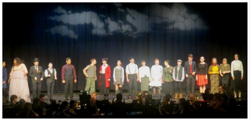(Image: The Cast Gathers Downstage for
 their FInal Bows)
