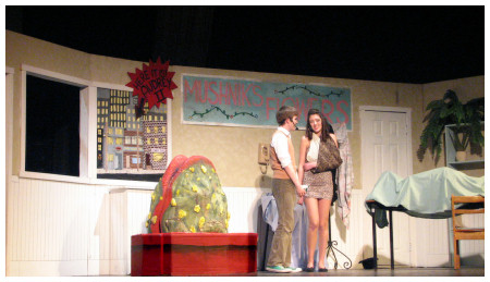 (Image: Seymore and Audrey talk in the Flower Shop
 while Audrey II Listens)