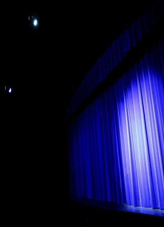 (Image Right: Stage Curtain Lit in Blue)