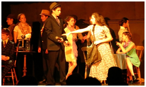 (Image: Annie Reaches to Retrieve her Baseball Bat
 from Bugsy at the Speakeasy)