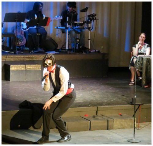 (Image: CEE Partially Crouches as he Performs
  a Solo Number on the Thrust Stage)