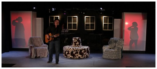 (Image: A Guitar Player Serenades while Shadows
   Play on Two Windows.)