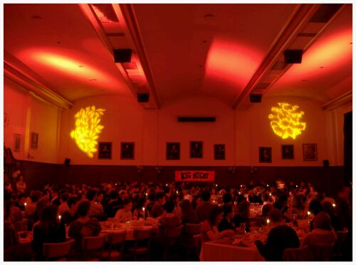 (Image: Students Eat under Candlelight and Red Top Lighting)