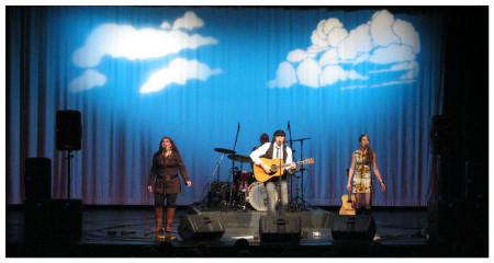 (Image: Clouds and a Blue Sky behind the Band)