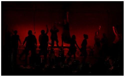 (Image: The Cast is Silhouetted as seen
        Against the Rear Wall)