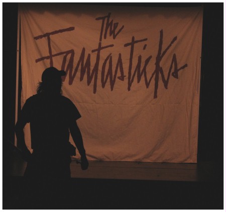 (Image: Richard is Silhouetted in front of the
  `Fantastics' Banner)