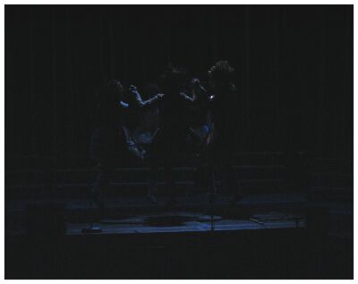 (Image: Dancers Silhouetted in a Circle)