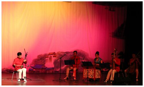 (Image: A Traditional Chinese Band Performs
  with a Soloist Musician)